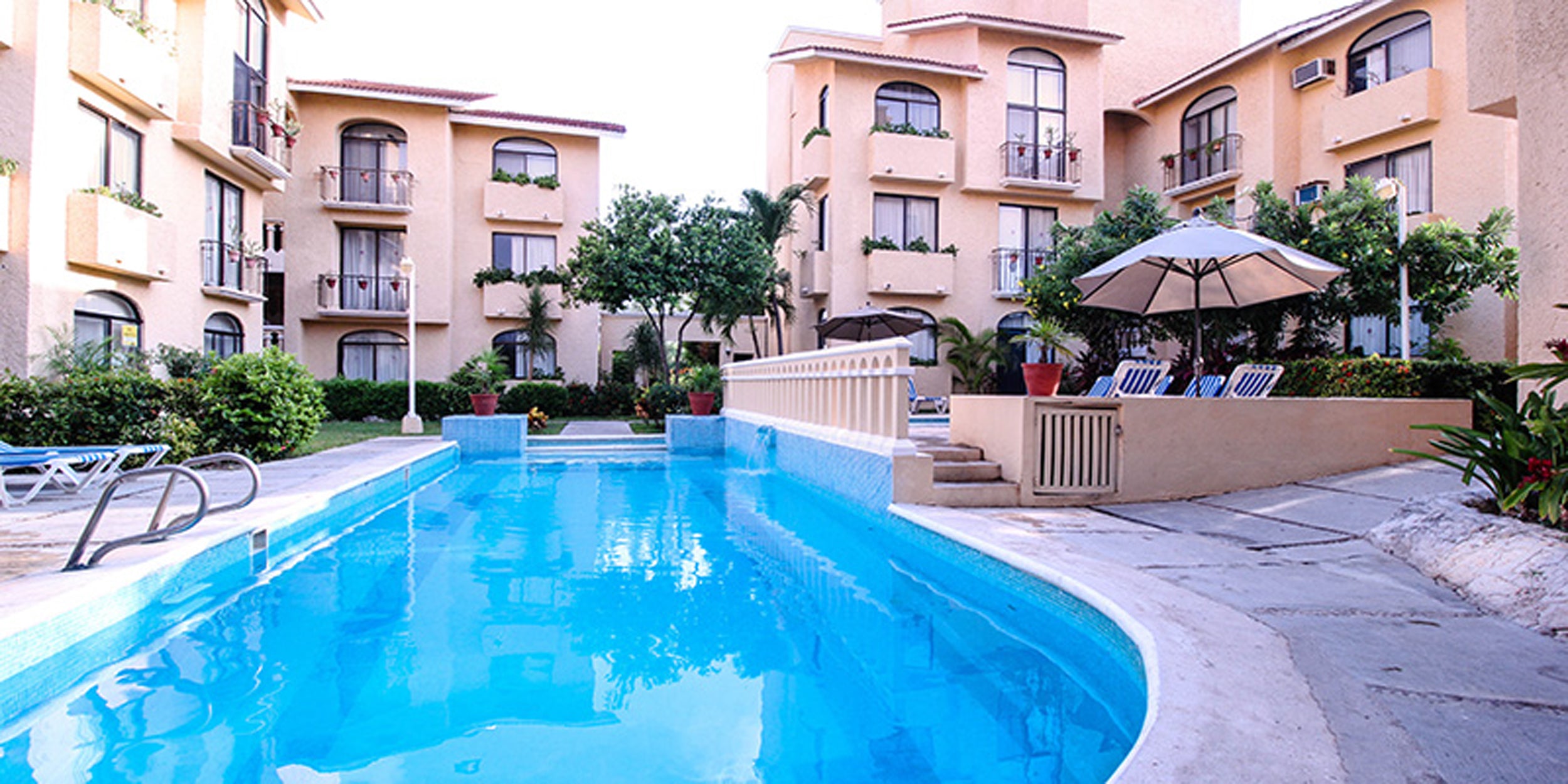 Pool area with a building in the background