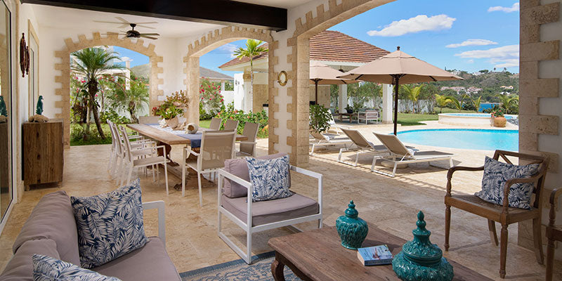 Modern patio with outdoor furniture, pool, and scenic view