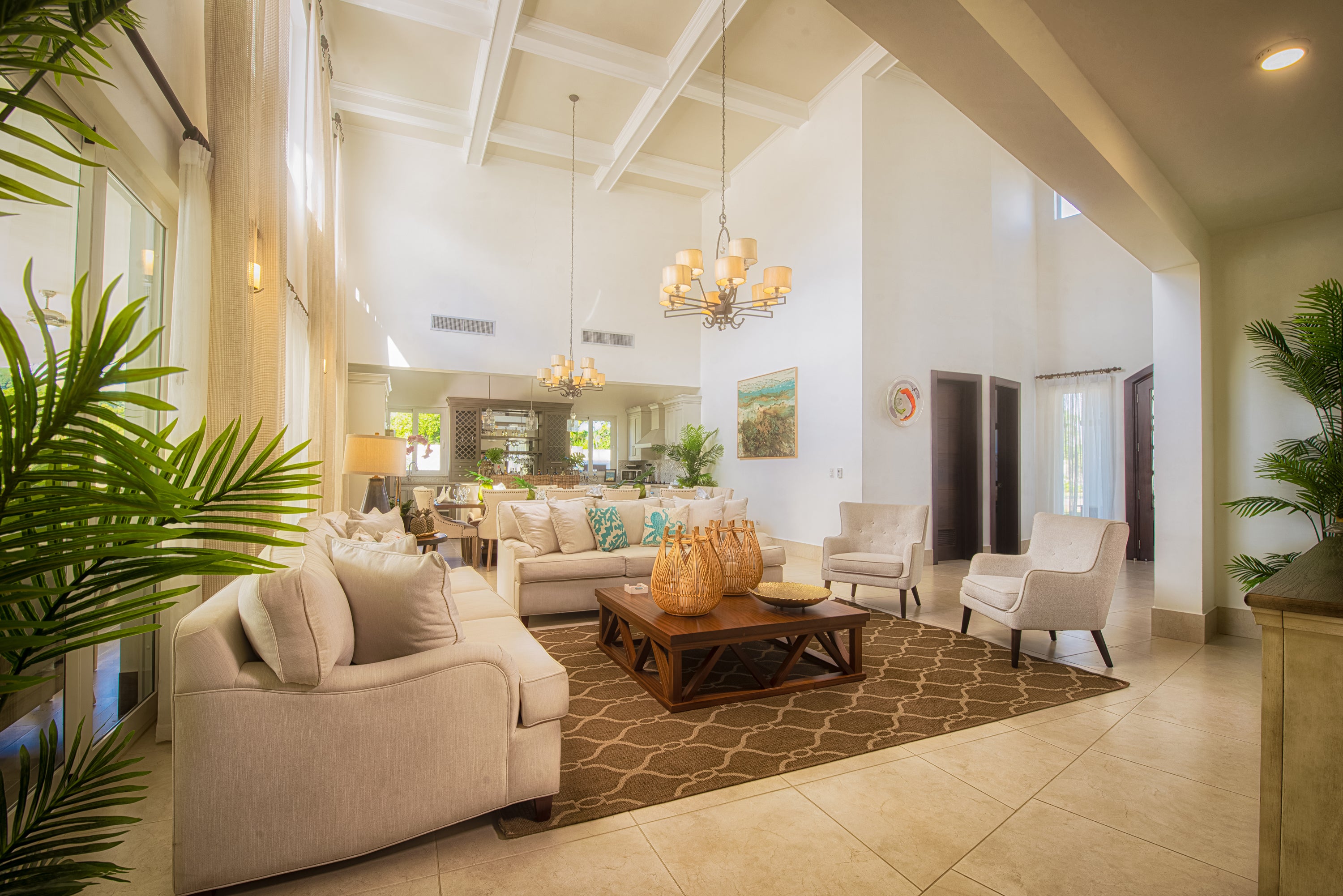 Modern living room with beige sofas, wooden coffee table, and decorative elements.