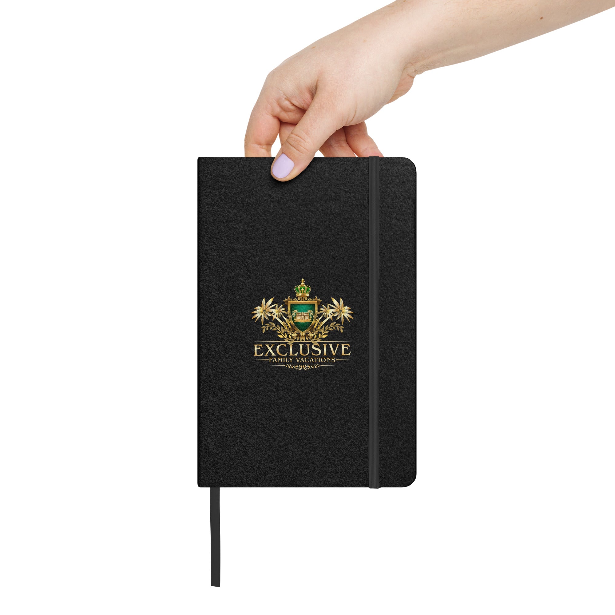 Black journal with a logo and text held by a hand on a white background