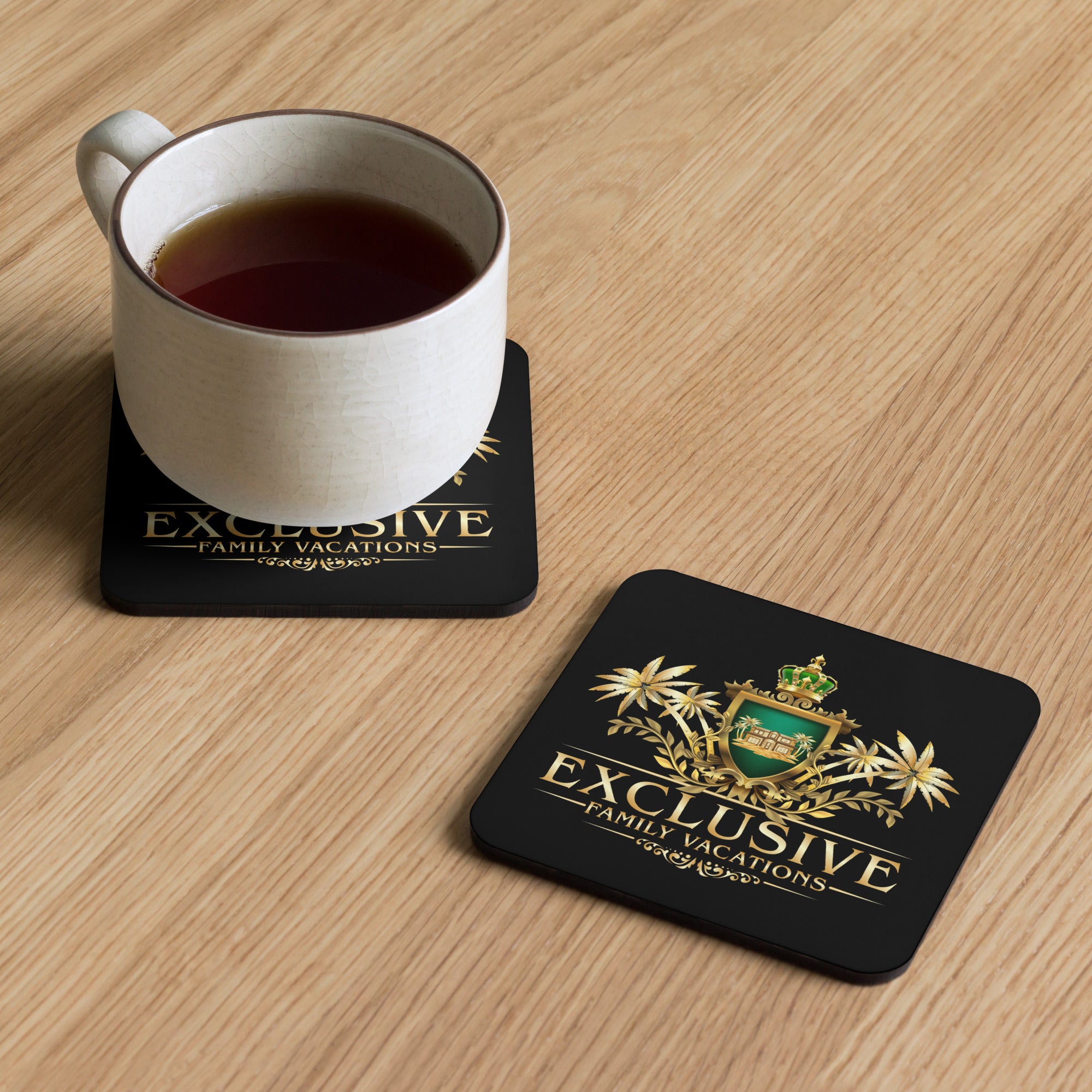 White mug with dark liquid on a coaster featuring 'Exclusive Family Vacations' branding.