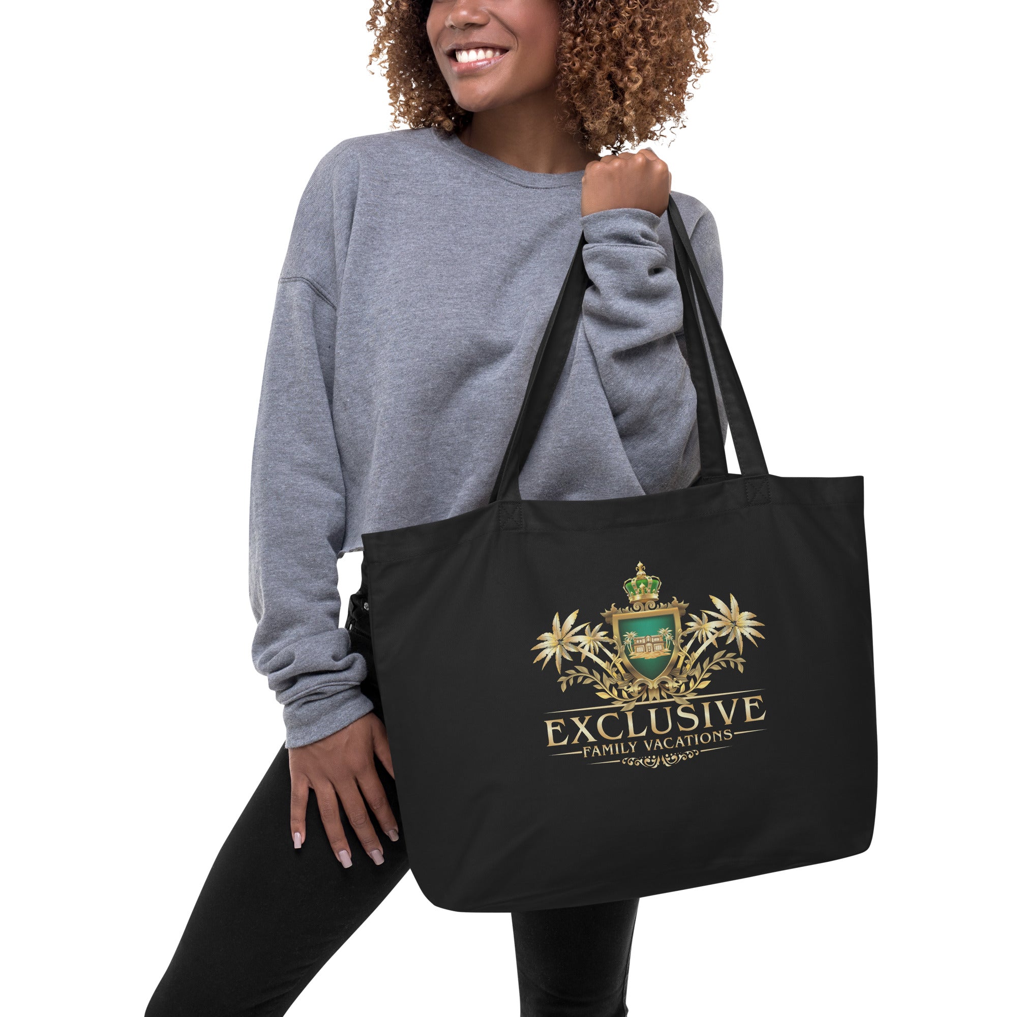 Woman holding a black tote bag with a logo and text on a white background