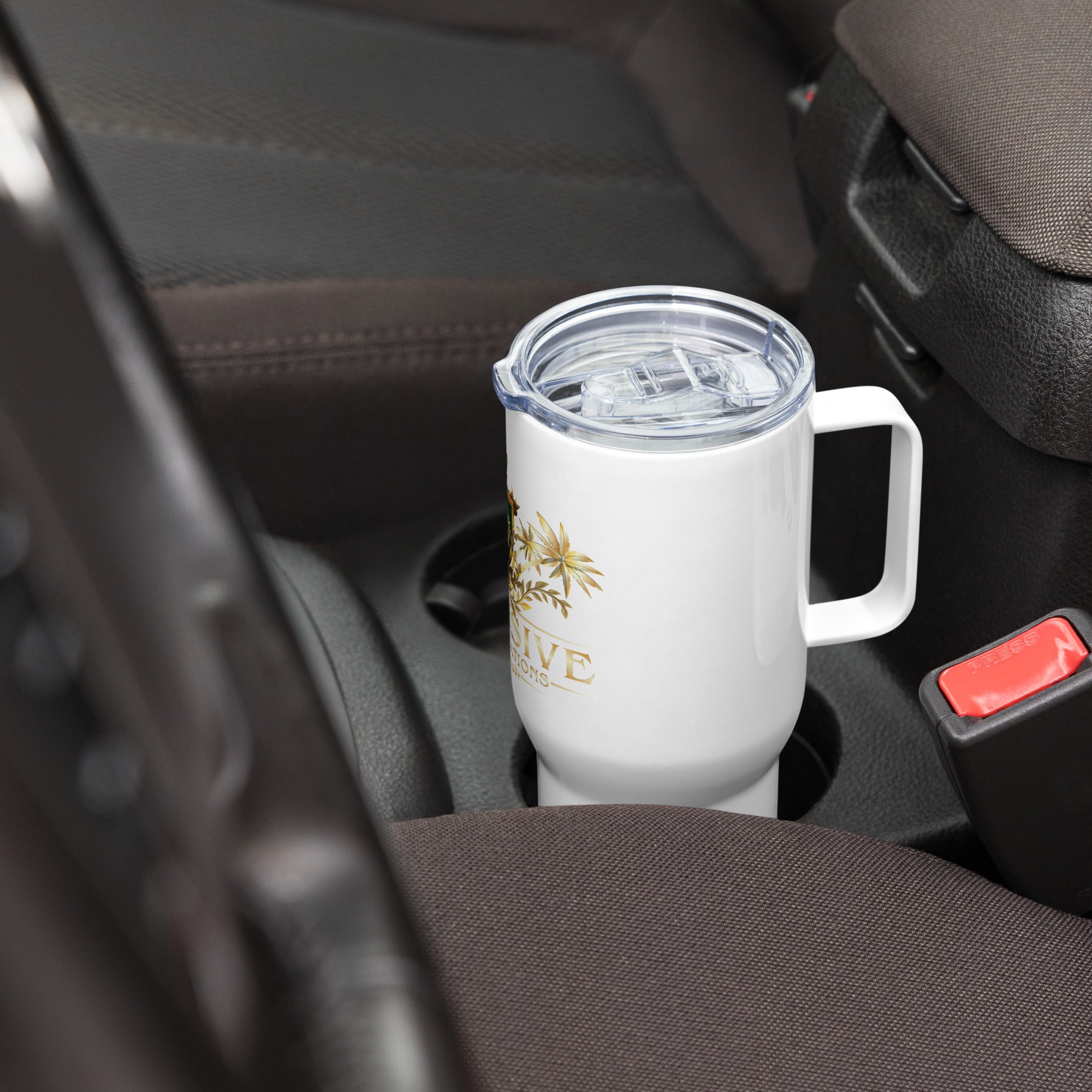 White mug with a clear lid in a car cup holder